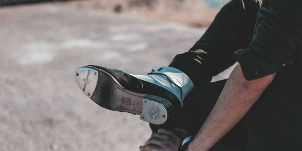 person in black and white nike sneakers