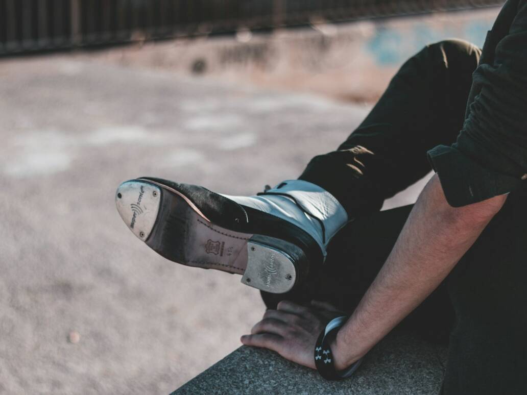 person in black and white nike sneakers