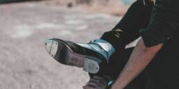 person in black and white nike sneakers
