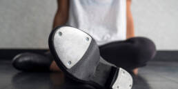 tap dancer relaxing in class