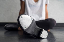 tap dancer relaxing in class