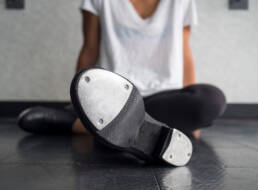 tap dancer relaxing in class
