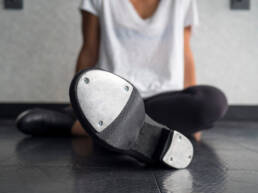 tap dancer relaxing in class