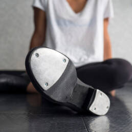 tap dancer relaxing in class